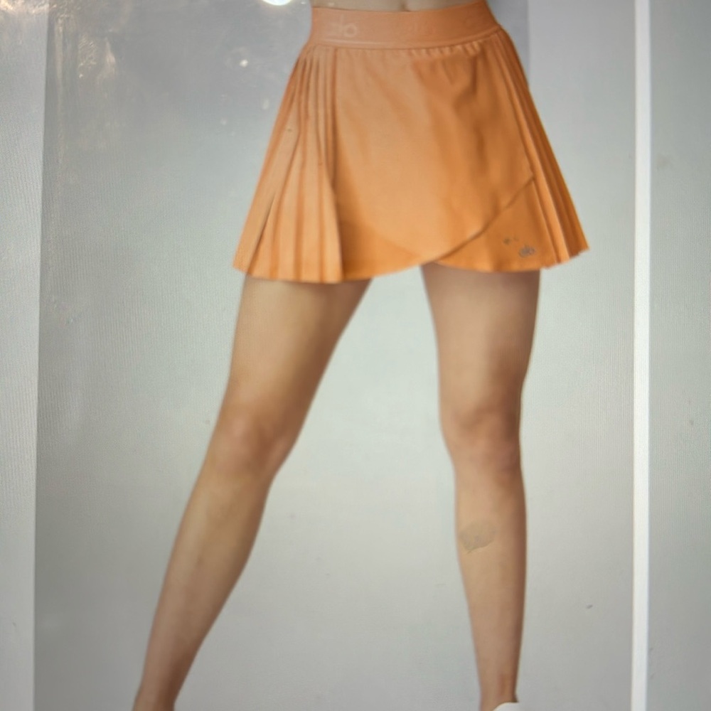 Alo, Aces tennis skirt xs. Cantaloupe color